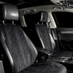 Properly installed Caltrend car seat covers with secure straps and smooth finish