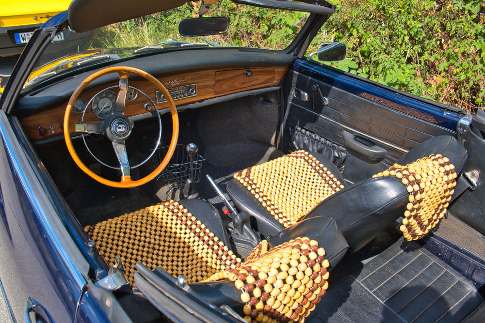 Close-up of beaded car seat covers installed in vehicle for long-drive comfort