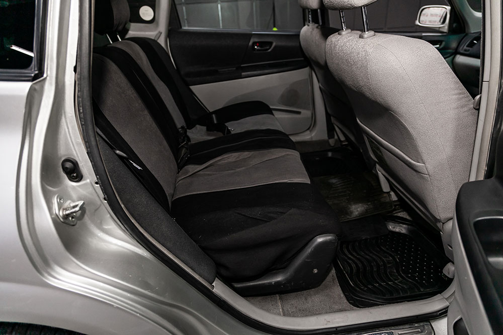 Close-up of custom Toyota seat covers in a family SUV with two-tone stitching