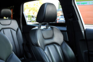 Custom-fit leather car seat covers installed in a modern SUV interior