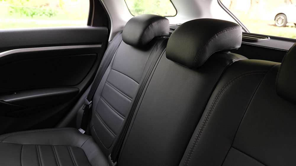 Heated car seat cover installed in a vehicle during winter