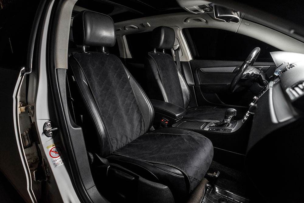 Heated car seat cover installed in a vehicle during winter