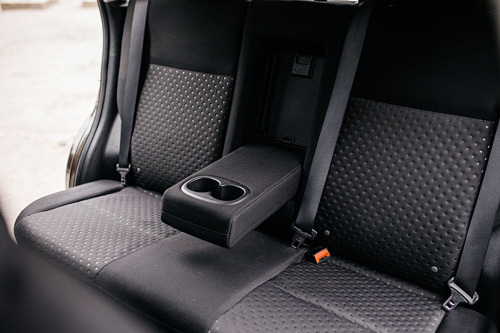 Heated car seat cover installed in a vehicle during winter
