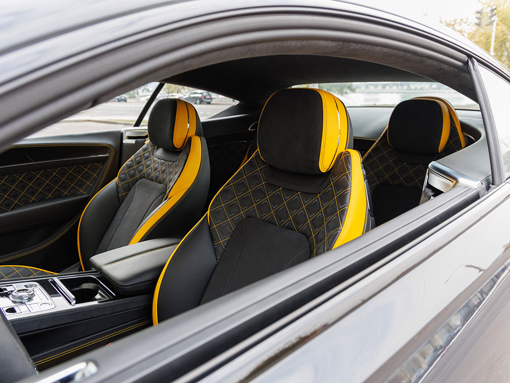 Heated car seat cover installed in a vehicle during winter