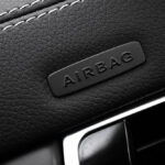 Custom car seat covers with airbag-compatible side stitching installed in a modern vehicle interior